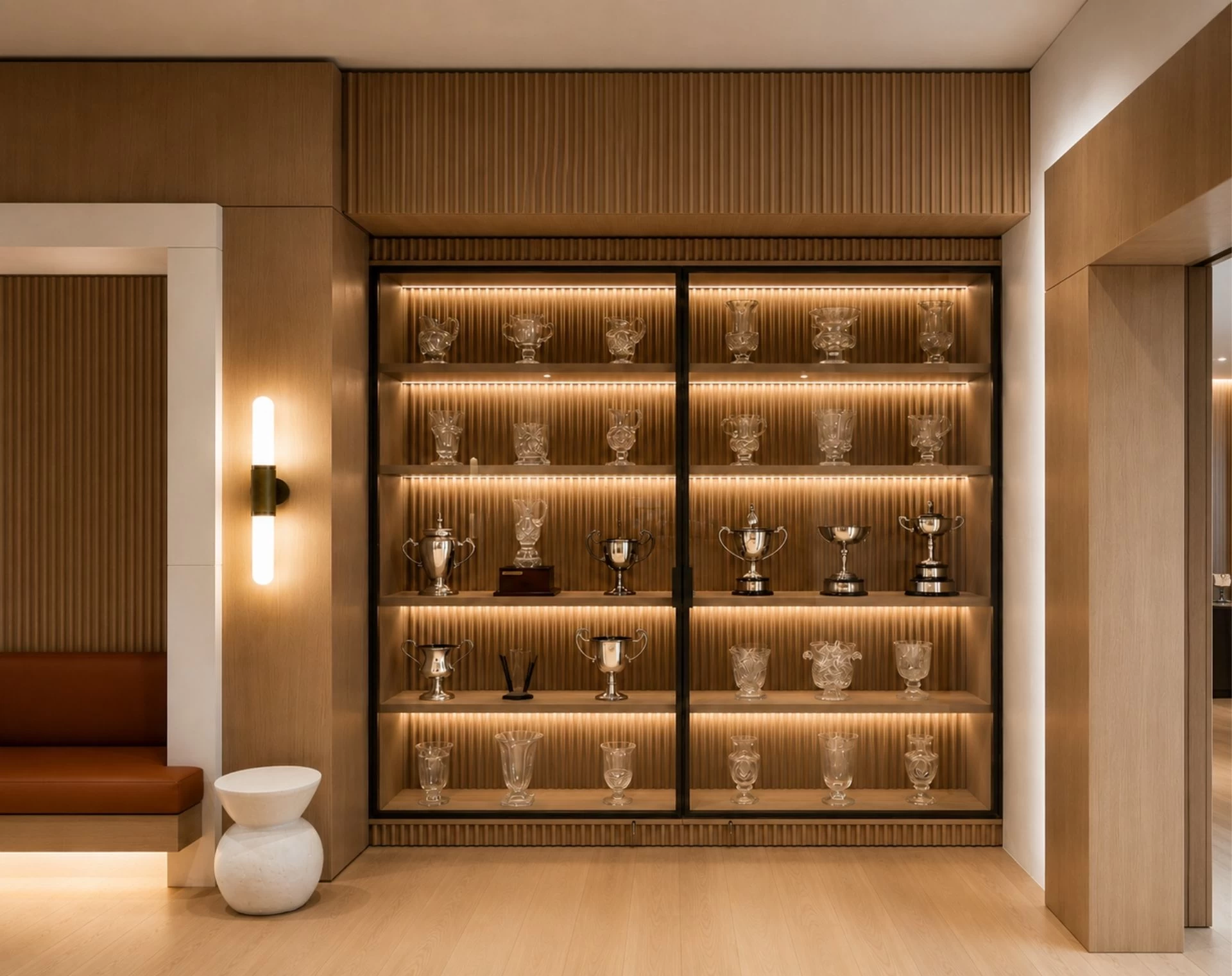 custom-wood-and-glass-trophy-showcase-with-integrated-led-lighting-barberini-interiors