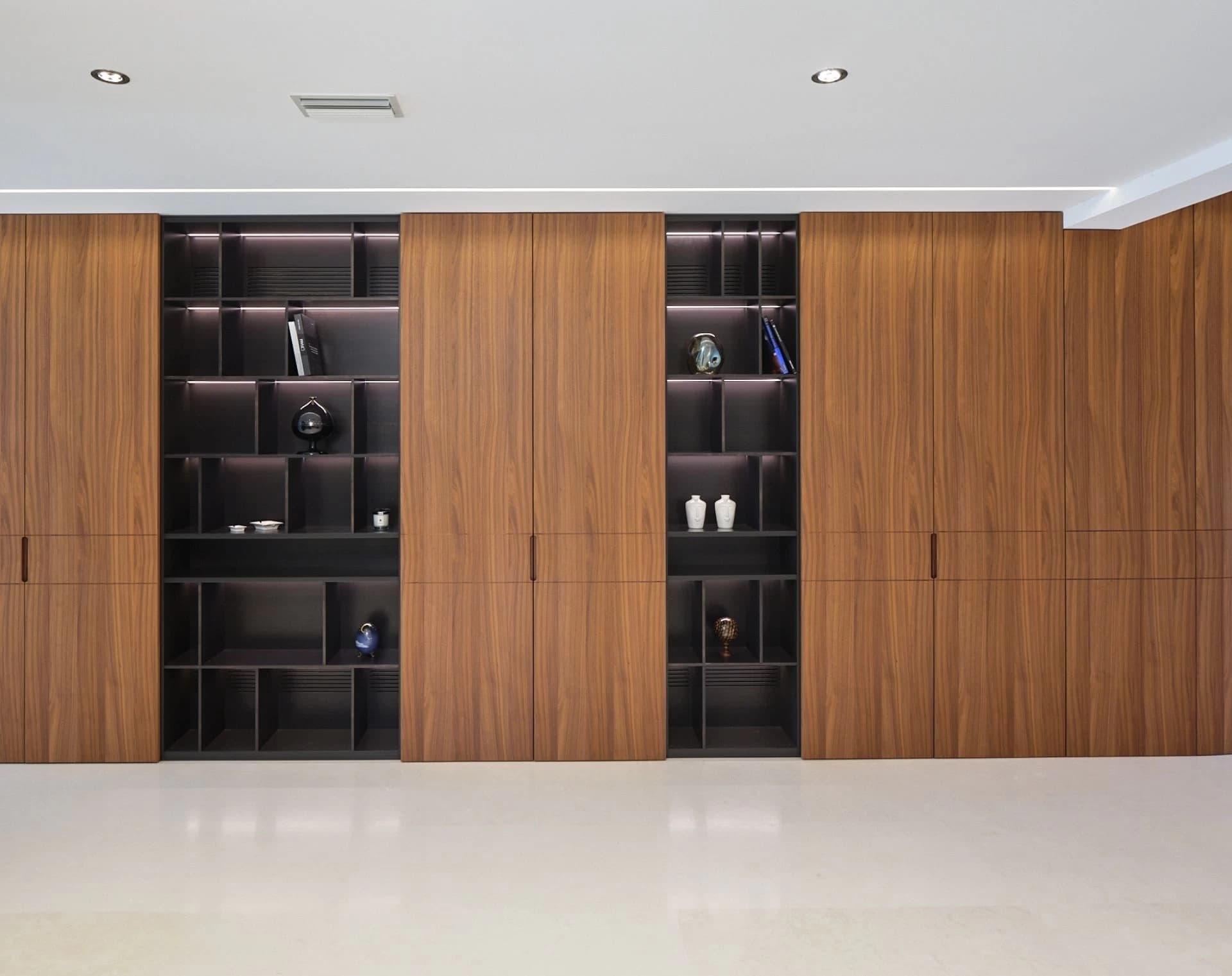 contemporary-villa-hallway-with-custom-wood-cabinetry-barberini-interiors